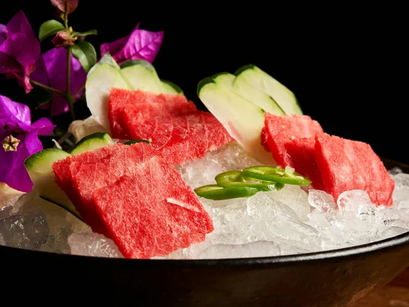 Fresh tuna sashimi served on ice with veggies at Umami Sushi & Ramen Bar, a Japanese Restaurant in Georgetown
